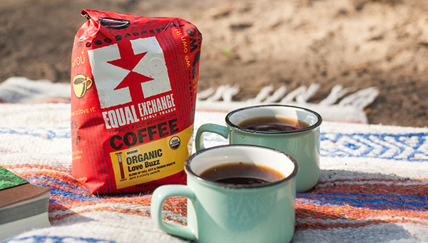 Coffee bag and mugs on a picnic blanket