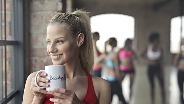 Woman drinking tea or coffee
